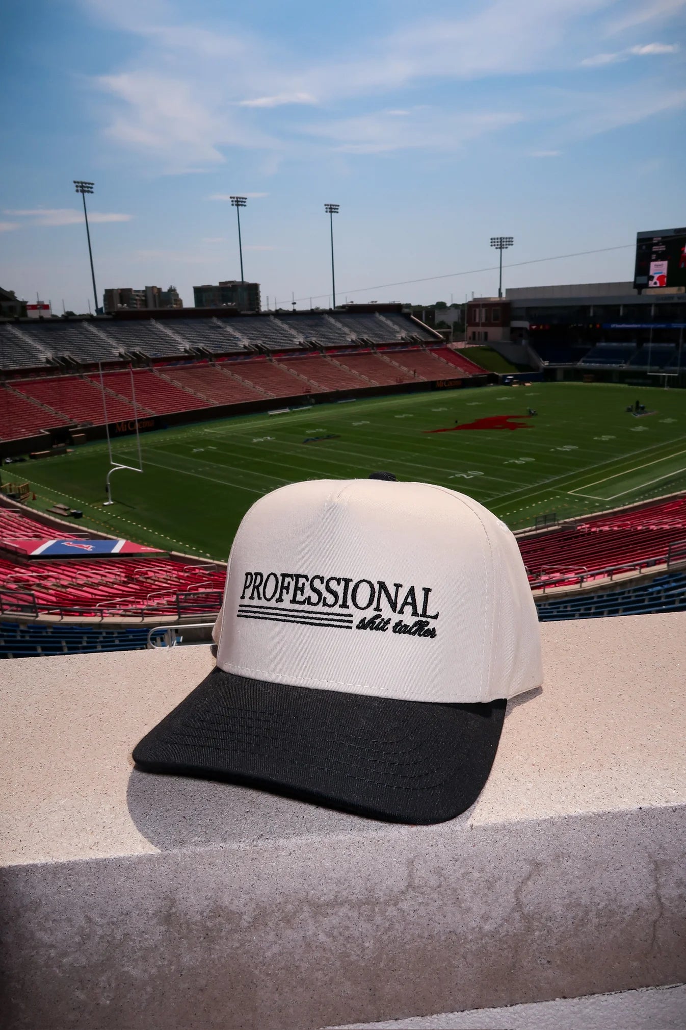 Cap with 'Professional Old Fashioned' text on a stadium background