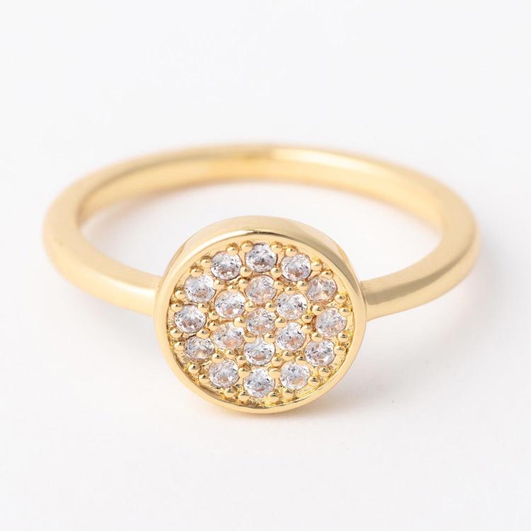 Gold ring with diamond-studded center on a white background