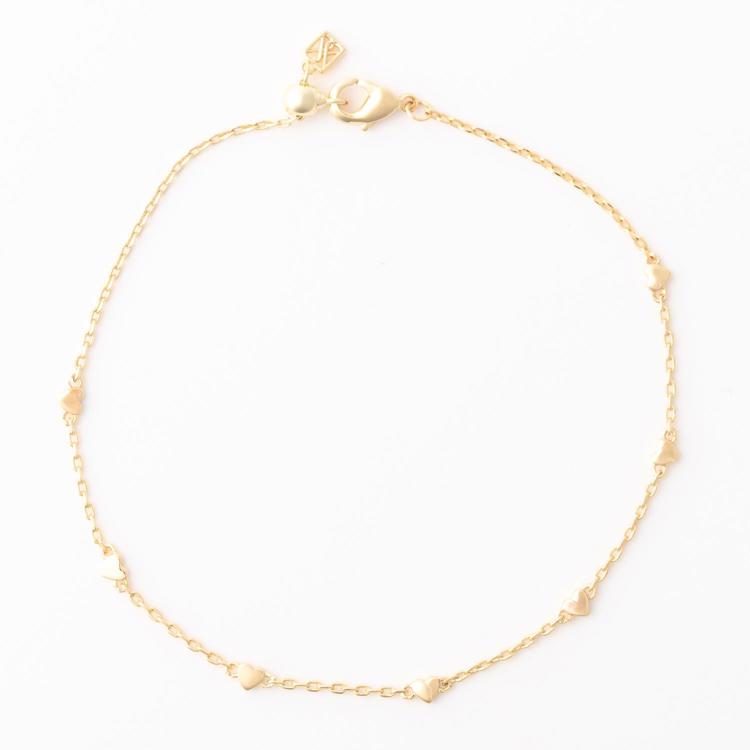 Gold bracelet on a white background
