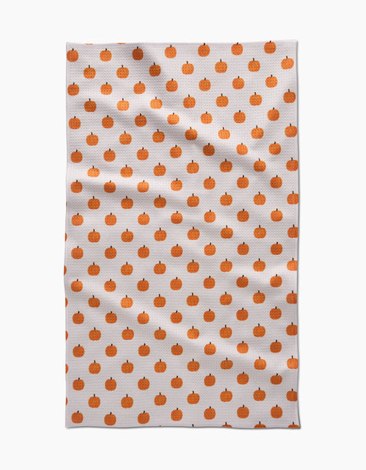 Tea towel with orange pumpkin pattern on a white background