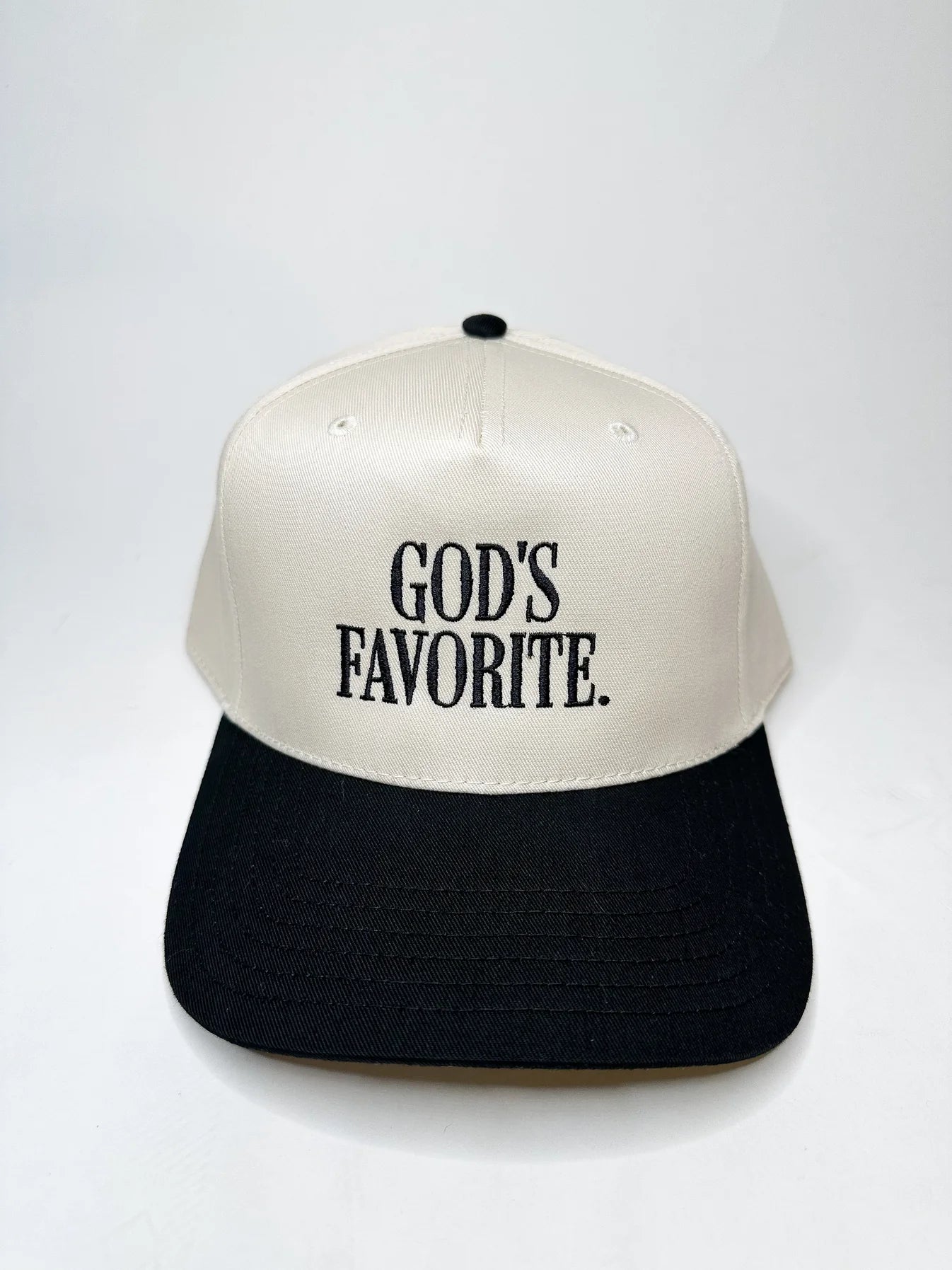 Cap with 'GOD'S FAVORITE.' text on a white background