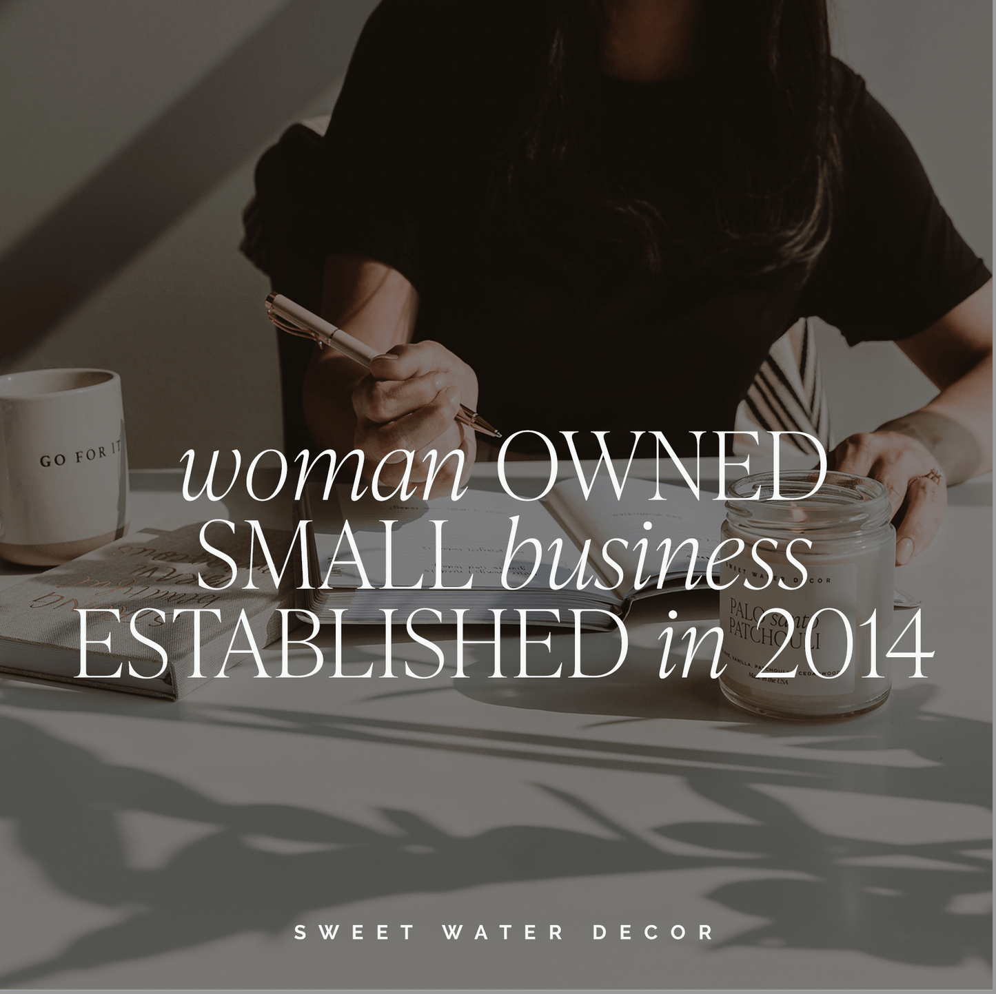 Person sitting at a table with a cup and notebook, text overlay about a woman-owned small business established in 2014, Sweet Water Decor branding.